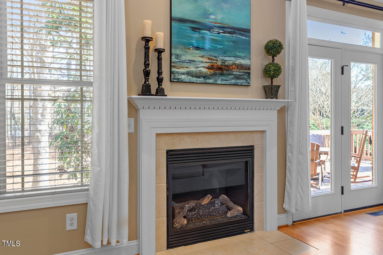 102 Juliet Circle Cary, NC 27513 - Photo 12 of 42 a living room with a fireplace and a window