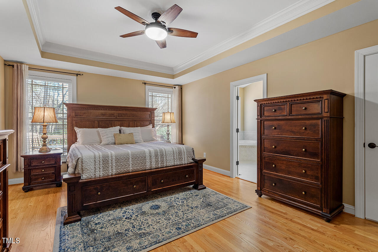 102 Juliet Circle Cary, NC 27513 - Photo 22 of 42 a bedroom with a bed and a dresser