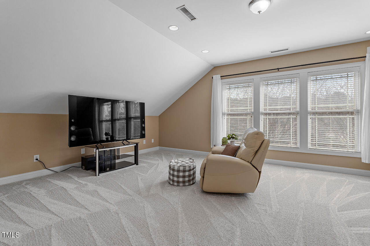 102 Juliet Circle Cary, NC 27513 - Photo 28 of 42 a living room with furniture and a large window