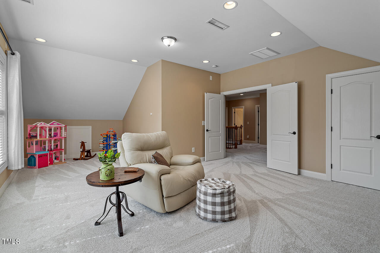 102 Juliet Circle Cary, NC 27513 - Photo 29 of 42 a living room with furniture and a table