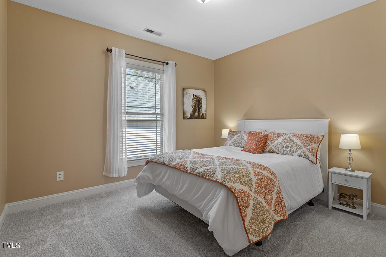 102 Juliet Circle Cary, NC 27513 - Photo 31 of 42 a bedroom with a bed and a window