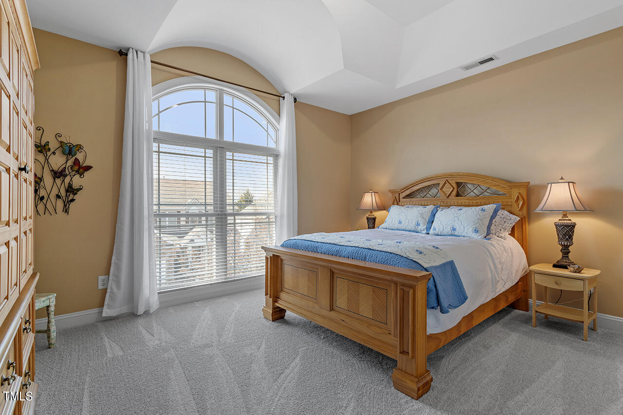 102 Juliet Circle Cary, NC 27513 - Photo 33 of 42 a bedroom with a bed and a window