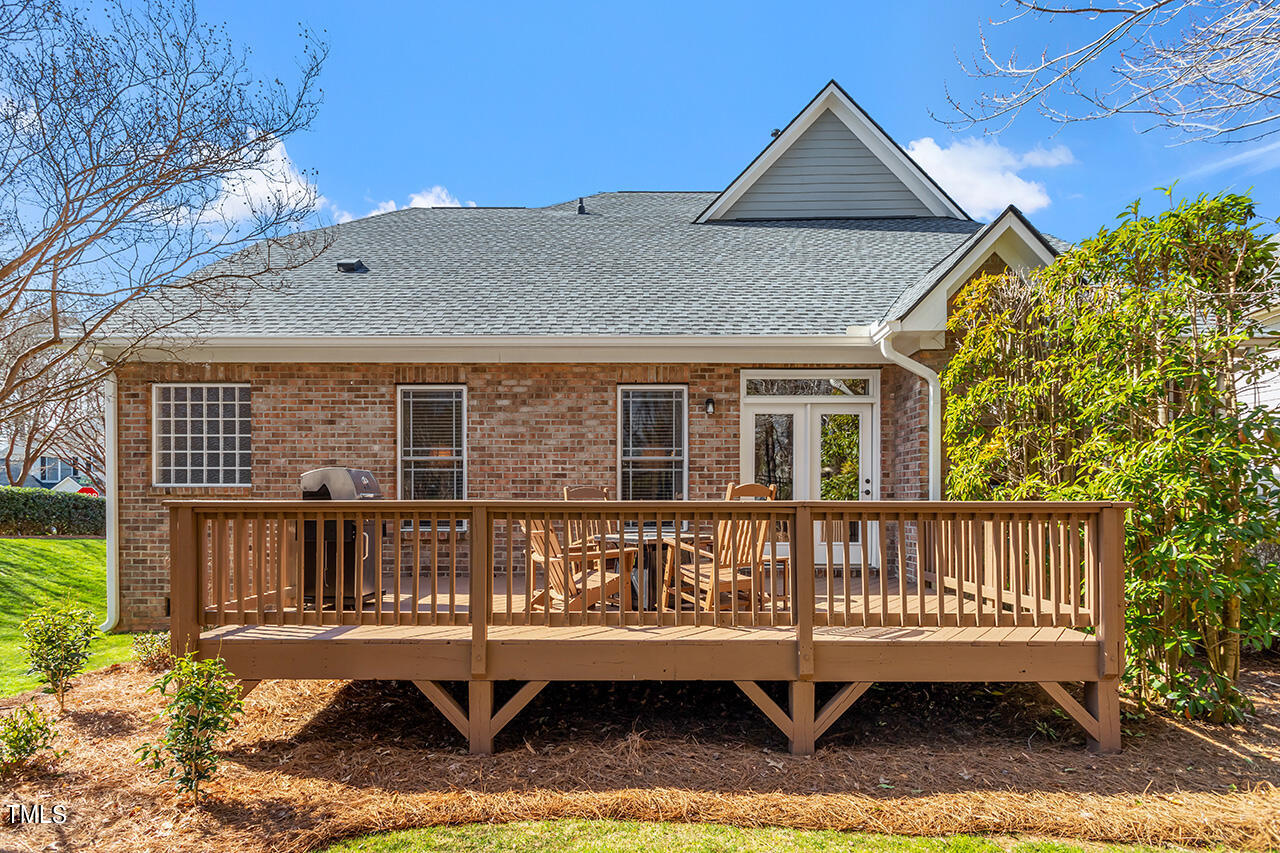 102 Juliet Circle Cary, NC 27513 - Photo 40 of 42 a view of a house with a yard and deck