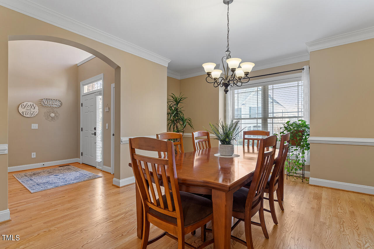 102 Juliet Circle Cary, NC 27513 - Photo 6 of 42 a view of a dining room with furniture and chandelier