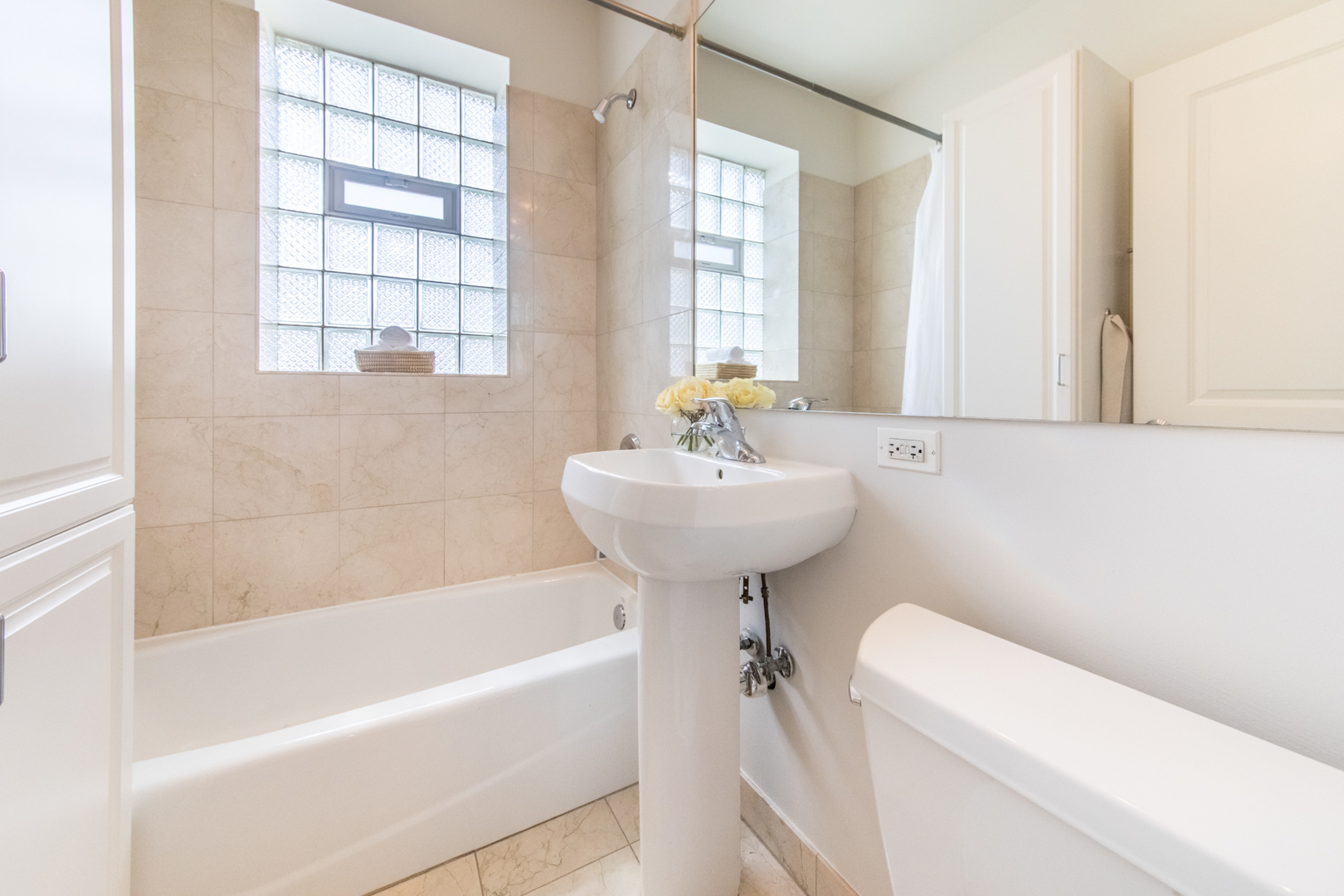 4306 North Clark Street, Unit 2 Chicago, IL 60613 - Photo 17 of 25 a bathroom with a sink a toilet and bathtub