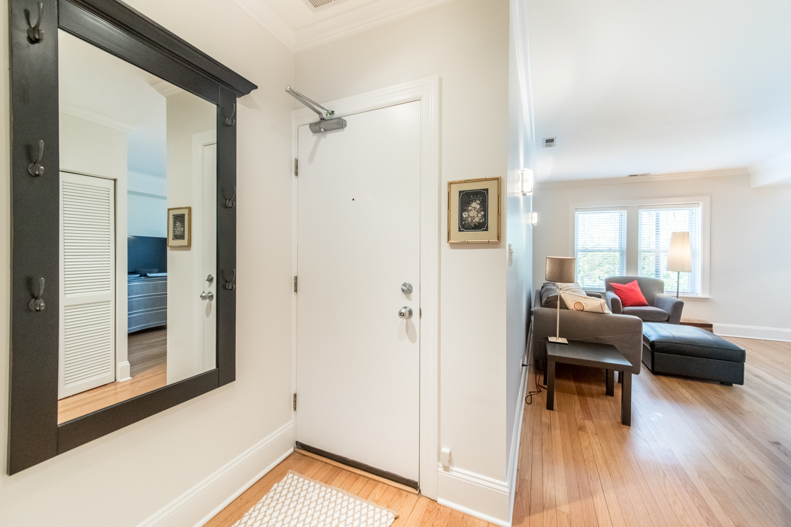 4306 North Clark Street, Unit 2 Chicago, IL 60613 - Photo 3 of 25 a living room with furniture and a wooden floor