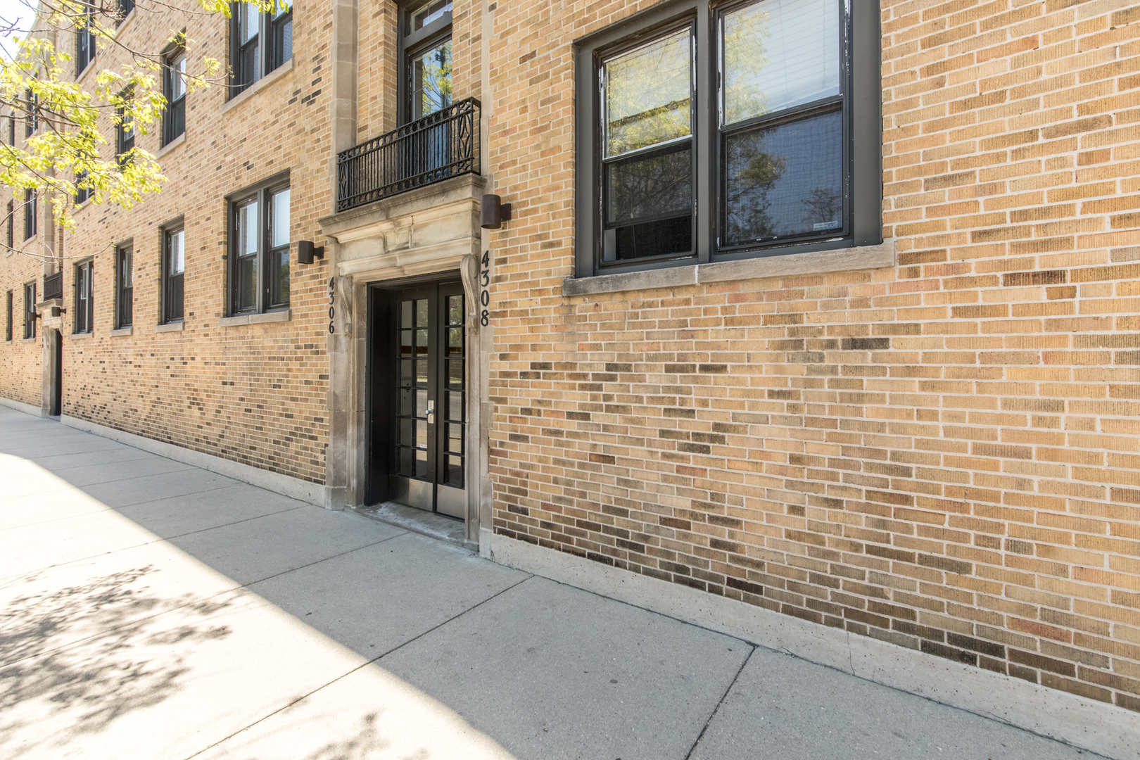 4306 North Clark Street, Unit 2 Chicago, IL 60613 - Photo 23 of 25 a view of a brick house with a large window