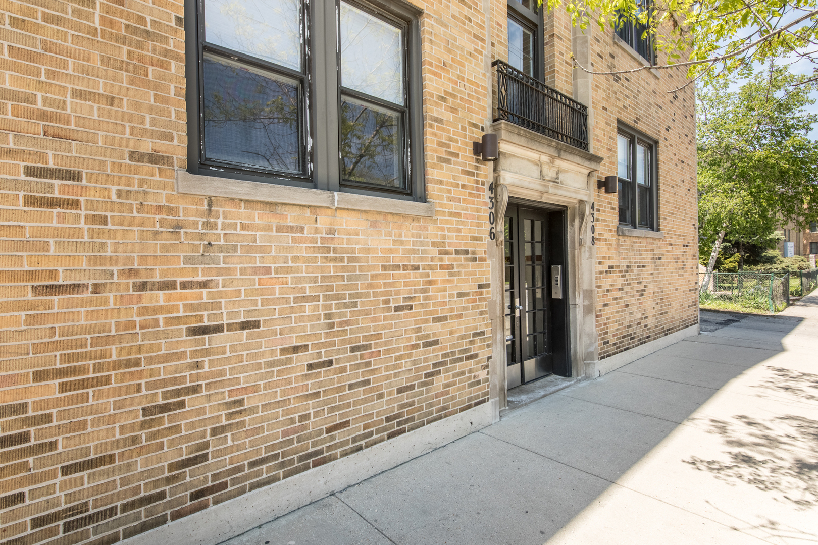 4306 North Clark Street, Unit 2 Chicago, IL 60613 - Photo 24 of 25 a view of a brick buildings with yard