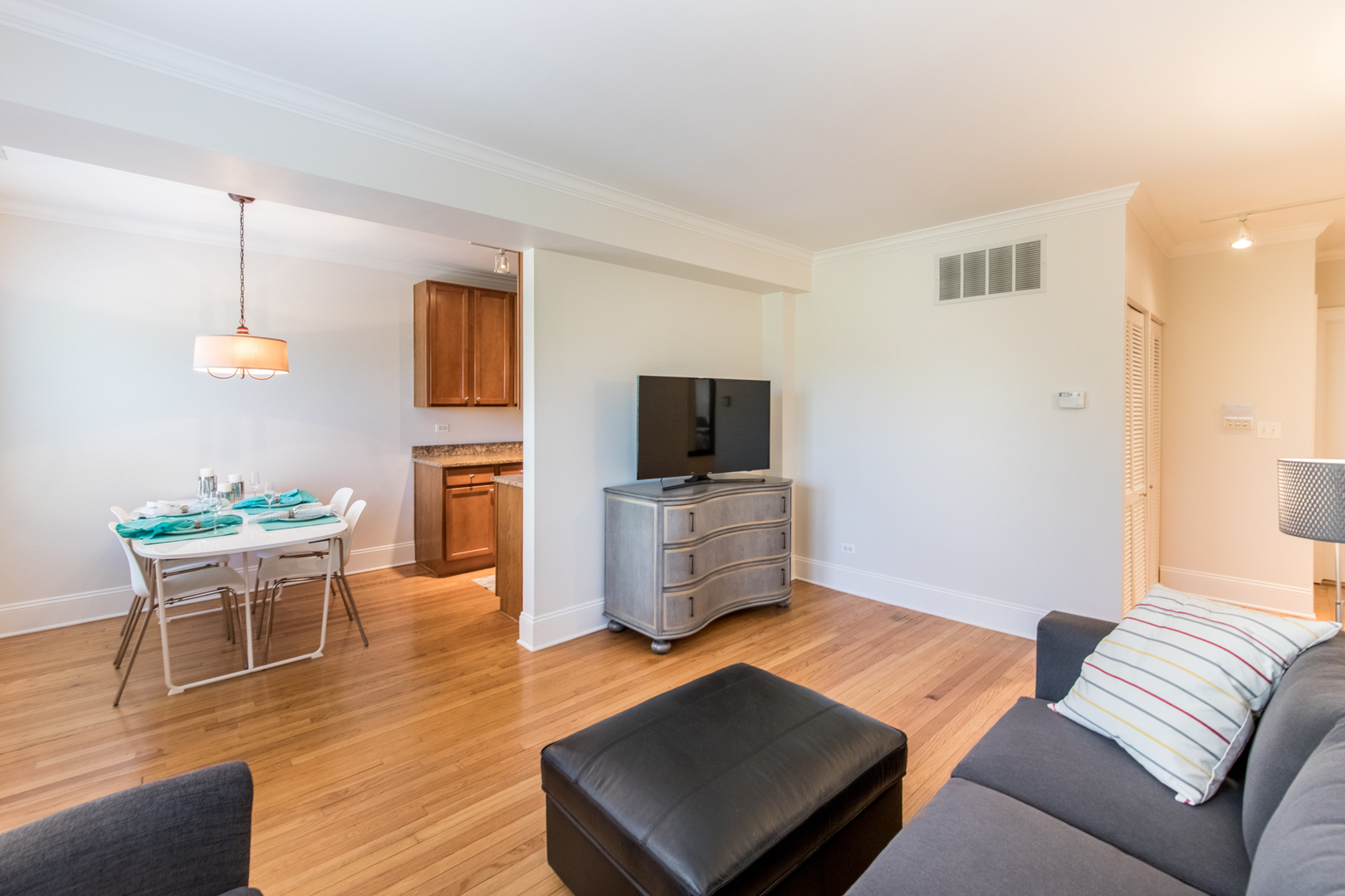 4306 North Clark Street, Unit 2 Chicago, IL 60613 - Photo 6 of 25 a living room with furniture and a flat screen tv
