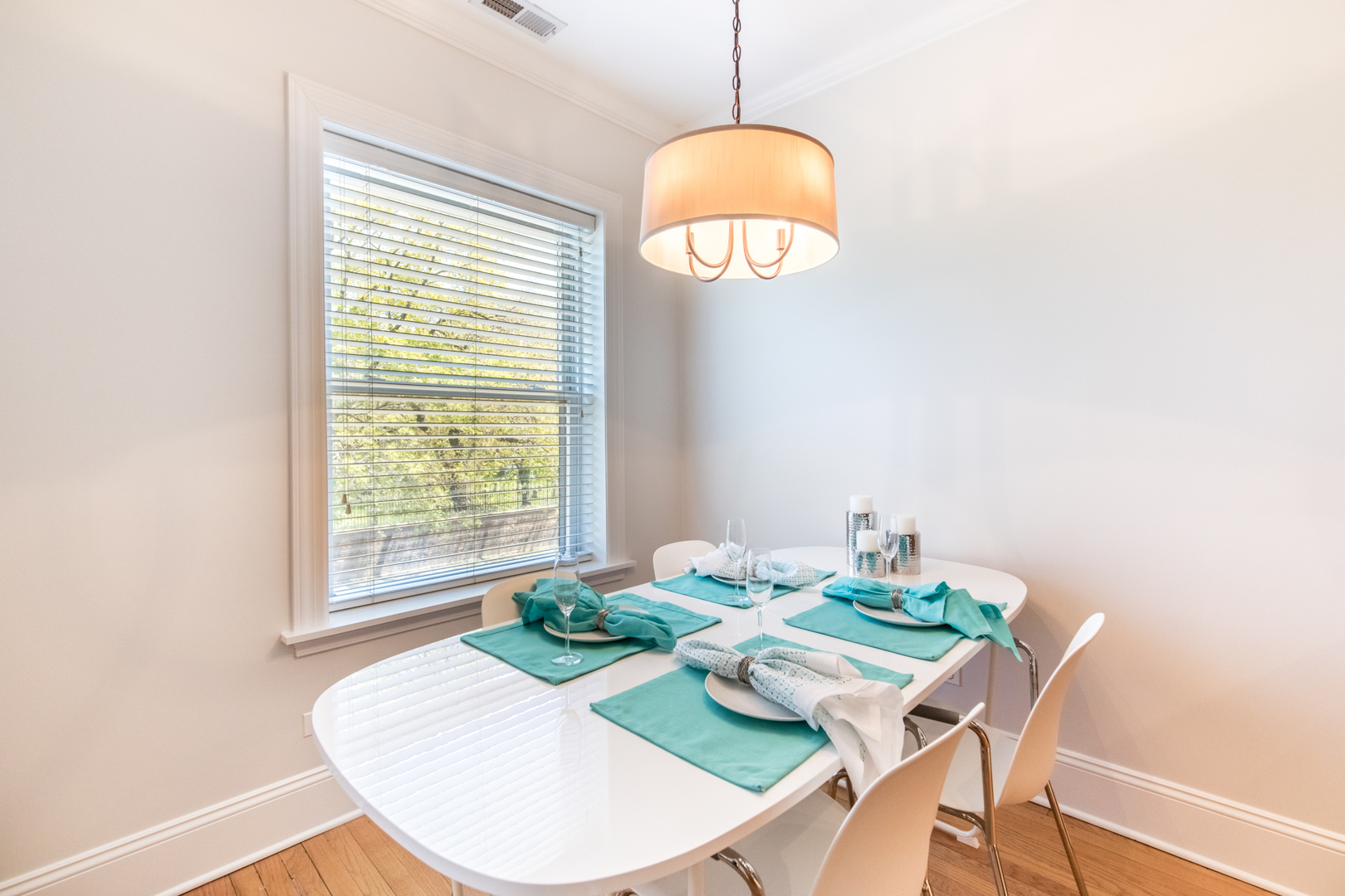 4306 North Clark Street, Unit 2 Chicago, IL 60613 - Photo 7 of 25 a view of a dining room with furniture wooden floor and chandelier