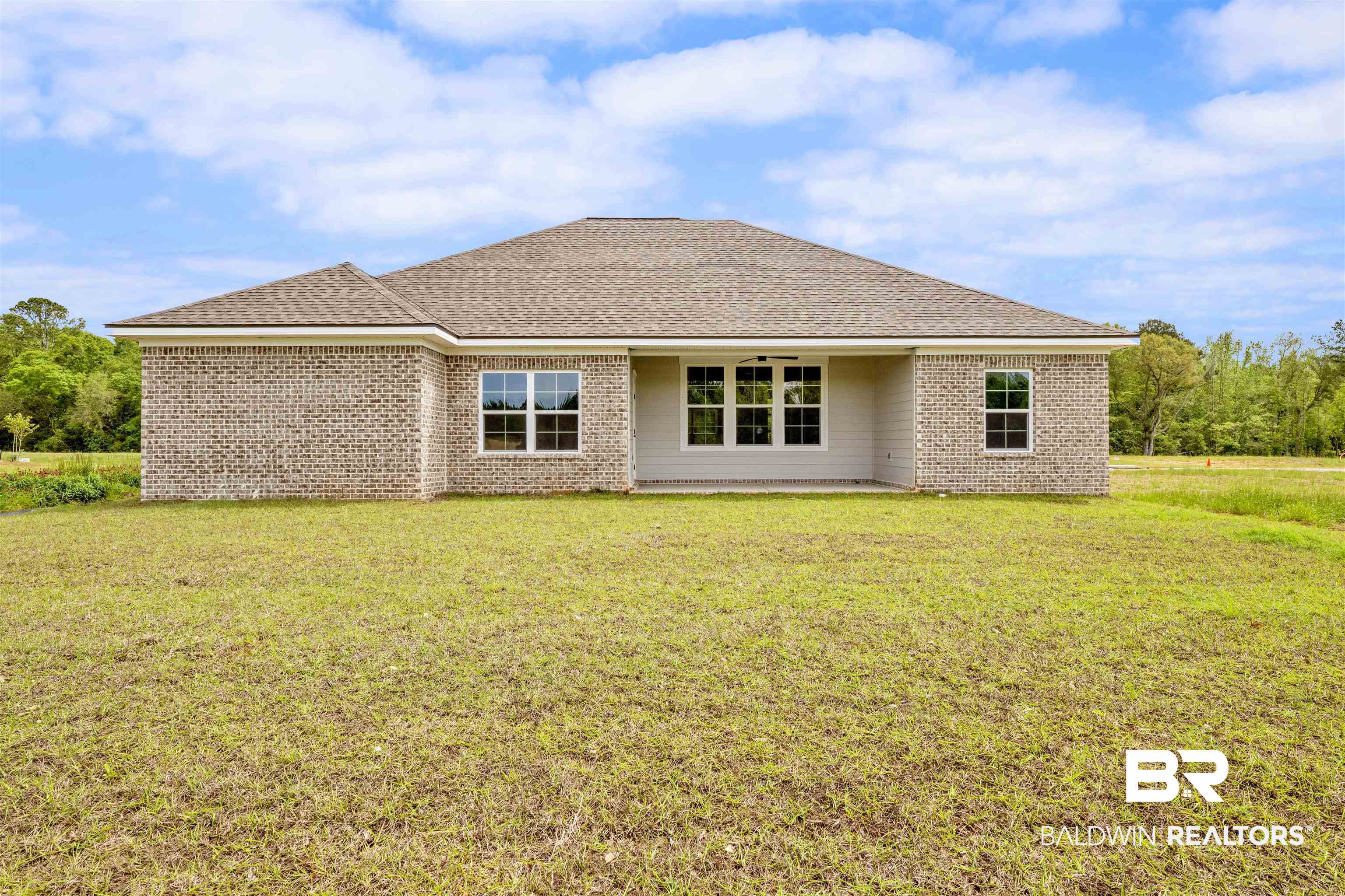 27315 Patch Pl Loop Daphne, AL 36526 - Photo 26 of 43 Rear view of house featuring a shingled roof, a yard, and brick siding