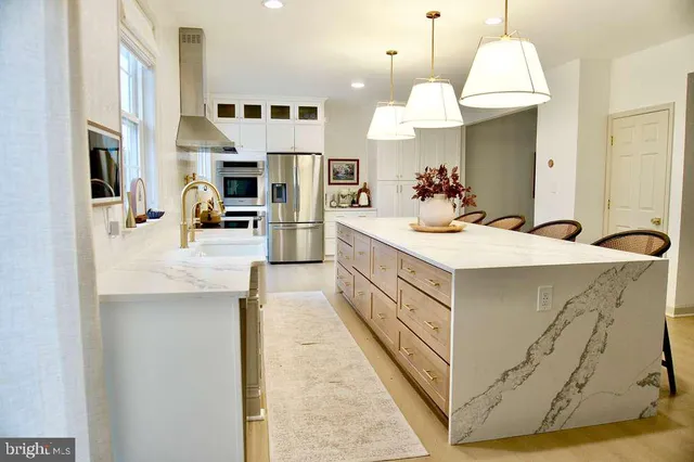 a bathroom with a sink a mirror and a shower