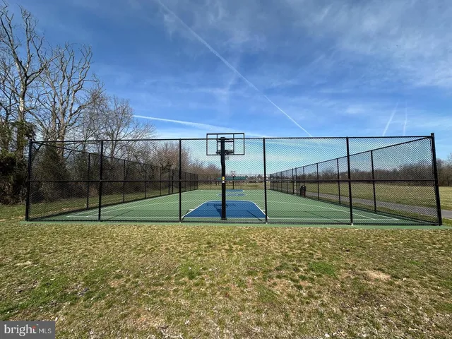 a view of pool and garden