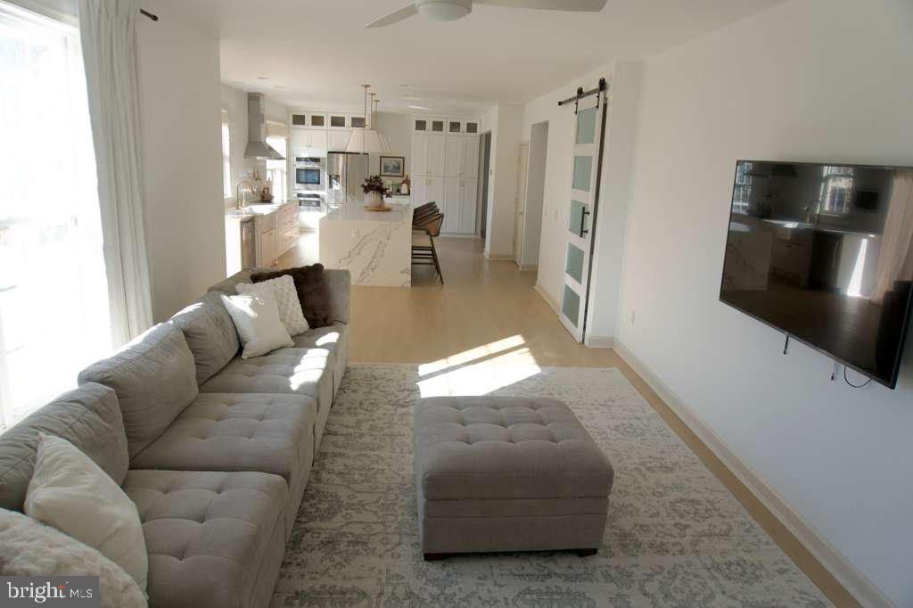 108 Wheeler Lane Frederick, MD 21702 - Photo 10 of 12 a living room with furniture and a flat screen tv