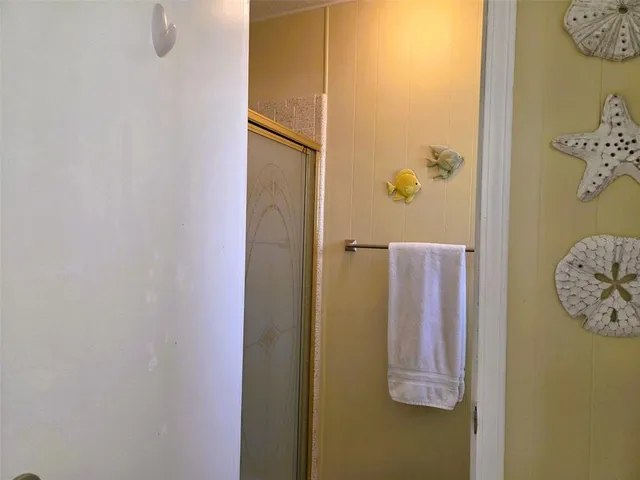 a view of a balcony with wooden floor