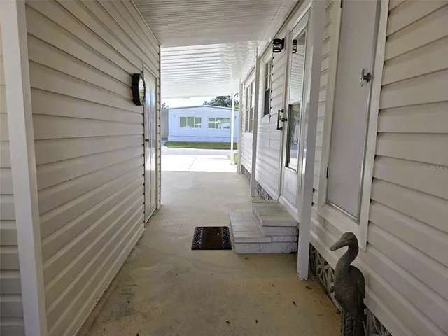 a view of a porch with seating space