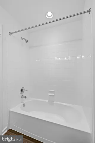 a bathroom with a shower and a shower