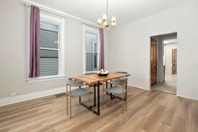 a view of a dining room with furniture and window