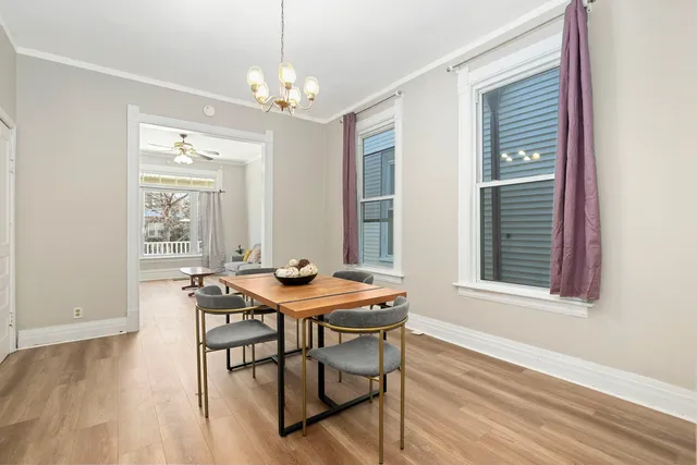 a view of a dining room with furniture and wooden floor