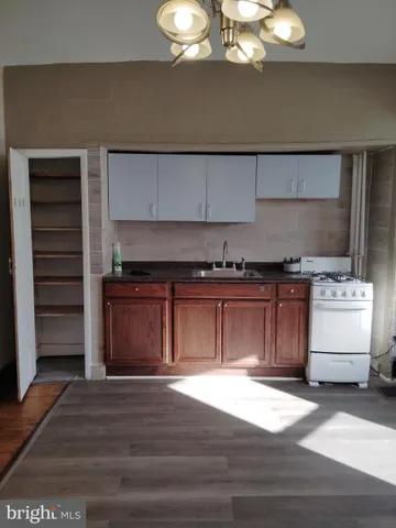 a kitchen with a stove and cabinets