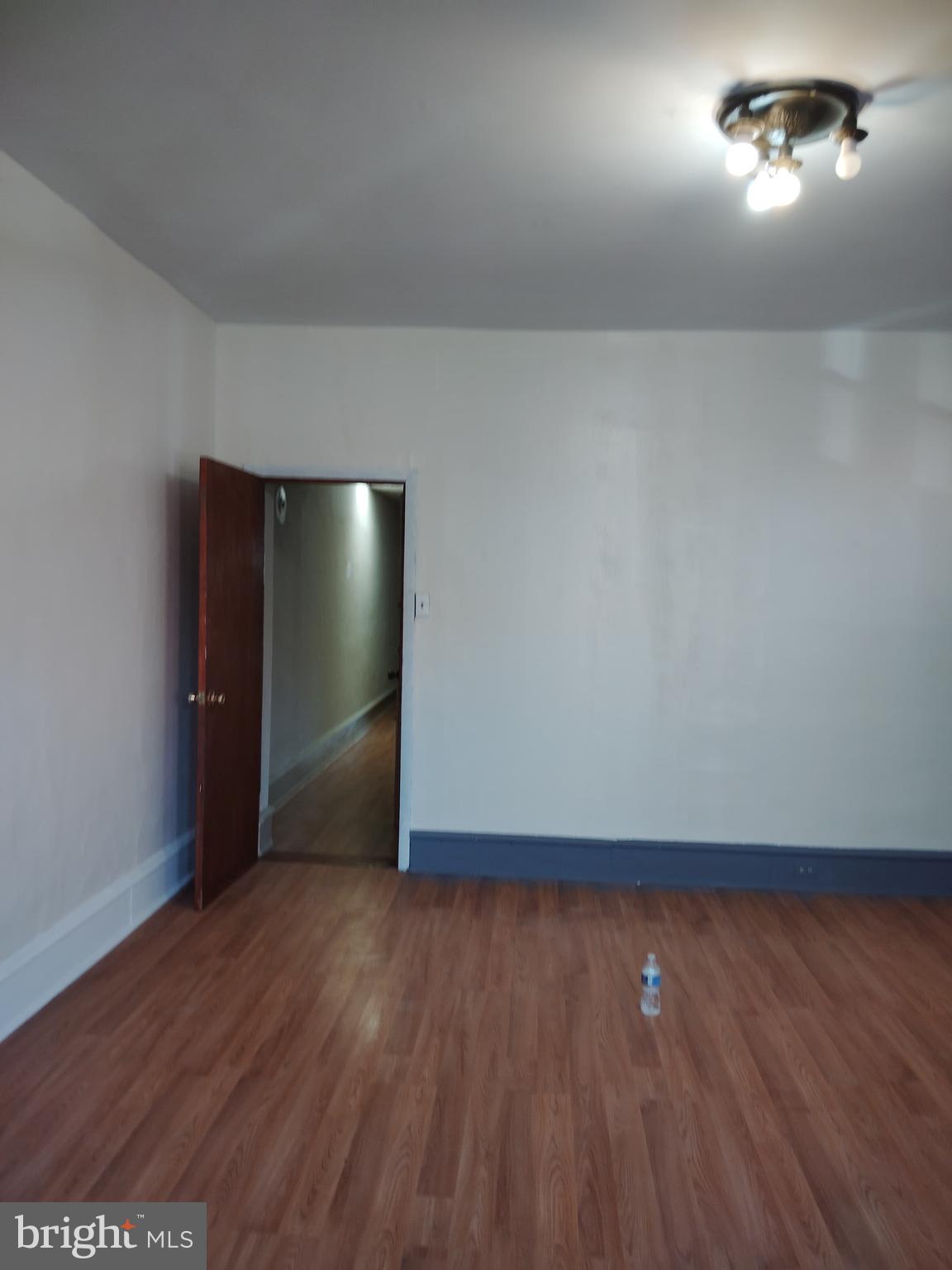 4514 Walnut Street Philadelphia, PA 19139 - Photo 7 of 10 an empty room with wooden floor and windows