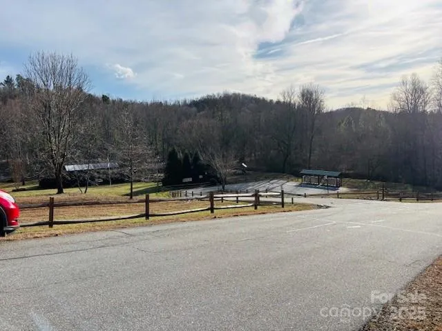 a sign broad in front of red brick house