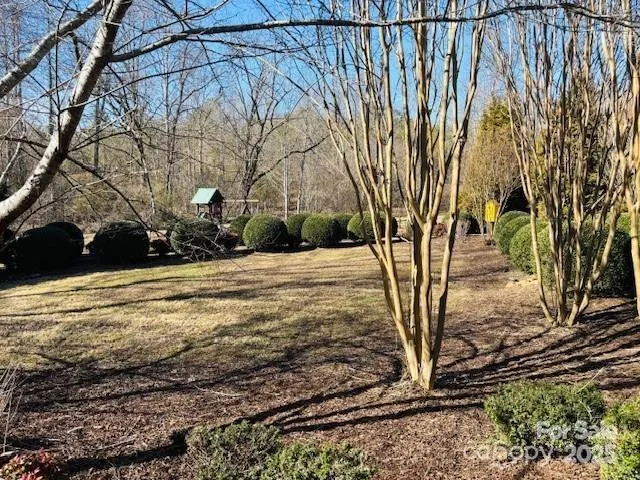 a swimming pool with some trees in the background
