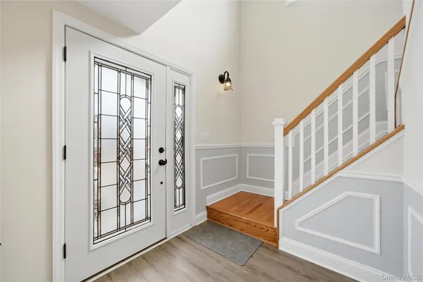 a view of staircase with white walls and windows