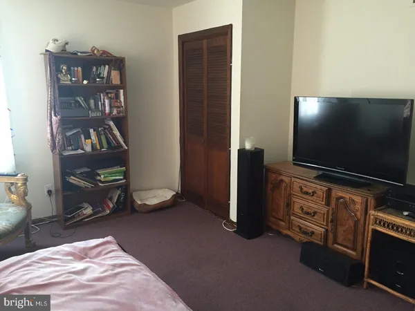 a room with furniture and a flat screen tv