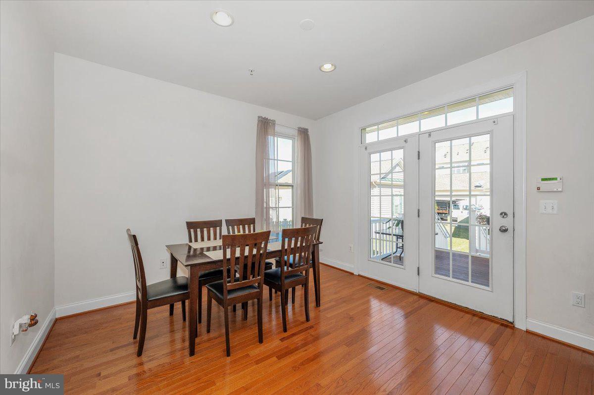 741 Appalachian Way Brunswick, MD 21716 - Photo 12 of 44 a view of a dining room with furniture and wooden floor