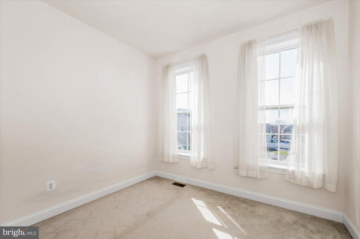 741 Appalachian Way Brunswick, MD 21716 - Photo 26 of 44 an empty room with windows