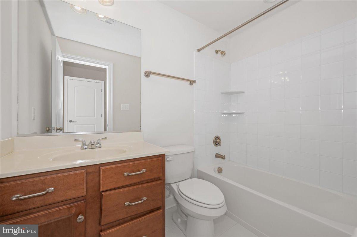 741 Appalachian Way Brunswick, MD 21716 - Photo 34 of 44 a bathroom with a granite countertop sink toilet and shower