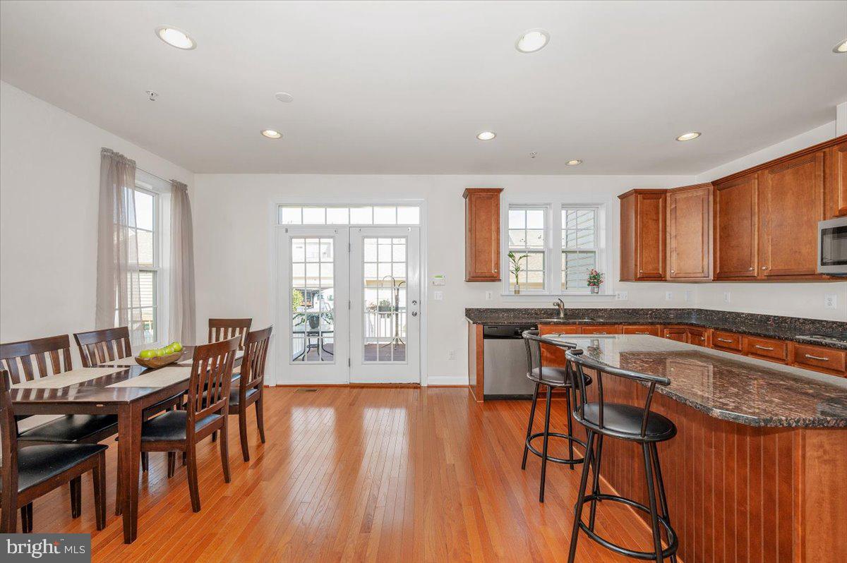 741 Appalachian Way Brunswick, MD 21716 - Photo 8 of 44 a large dining space with furniture and wooden floor