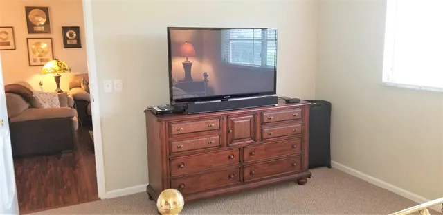 a room with cabinets and flat screen tv