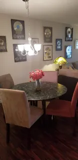 a view of a dining room with furniture and wooden floor