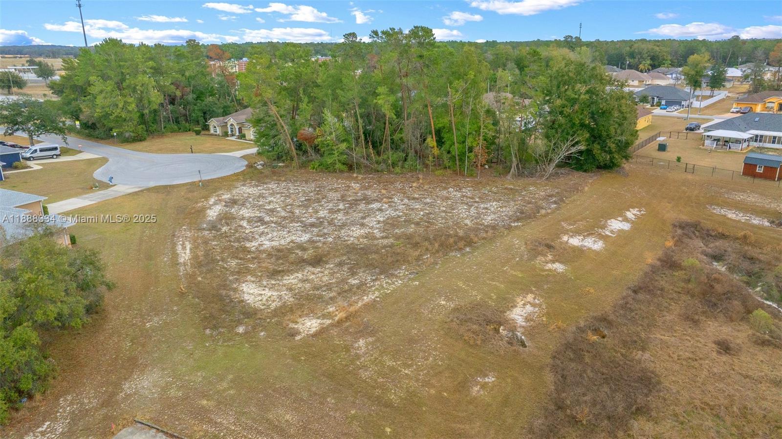 9559 Southwest 45th Court Ocala, FL 34476 - Photo 13 of 15 a view of a street with houses