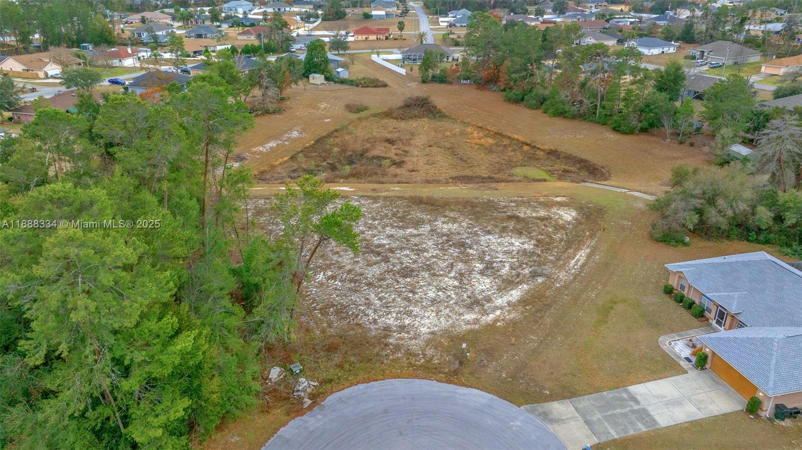 9559 Southwest 45th Court Ocala, FL 34476 - Photo 3 of 15 an aerial view of residential houses with outdoor space