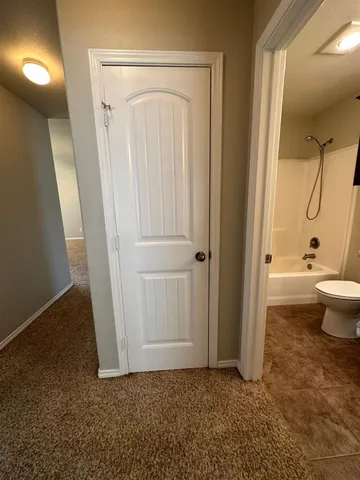 a bathroom with a sink toilet vanity and bathtub