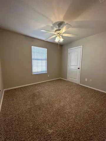 a view of empty livingroom with wooden floor