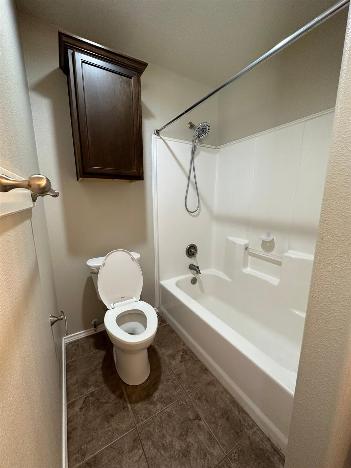 9316 Rochester Avenue Lubbock, TX 79424 - Photo 9 of 15 a bathroom with a toilet and a shower