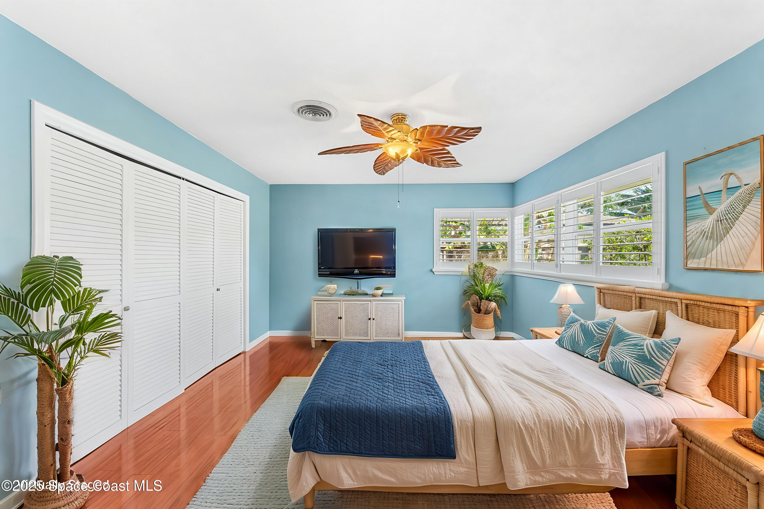 157 Cocoa Avenue Indialantic, FL 32903 - Photo 12 of 36 a bedroom with a bed and a chandelier