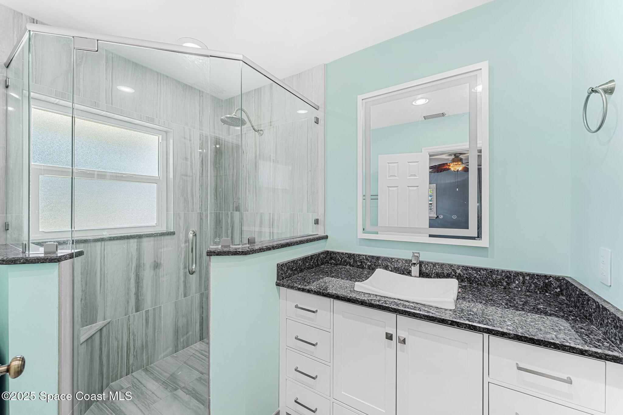 157 Cocoa Avenue Indialantic, FL 32903 - Photo 13 of 36 a bathroom with a granite countertop sink and a mirror