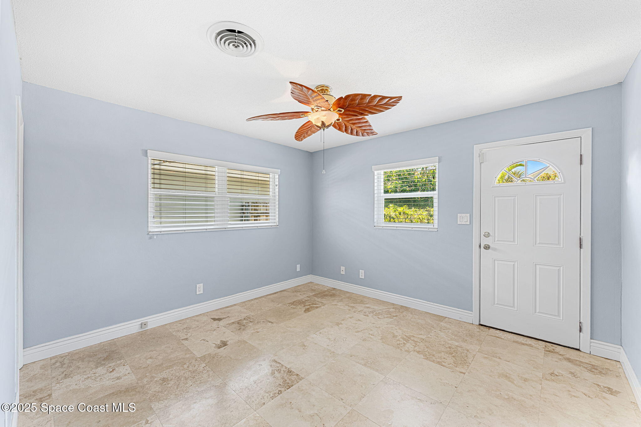 157 Cocoa Avenue Indialantic, FL 32903 - Photo 15 of 36 a view of an empty room with a window