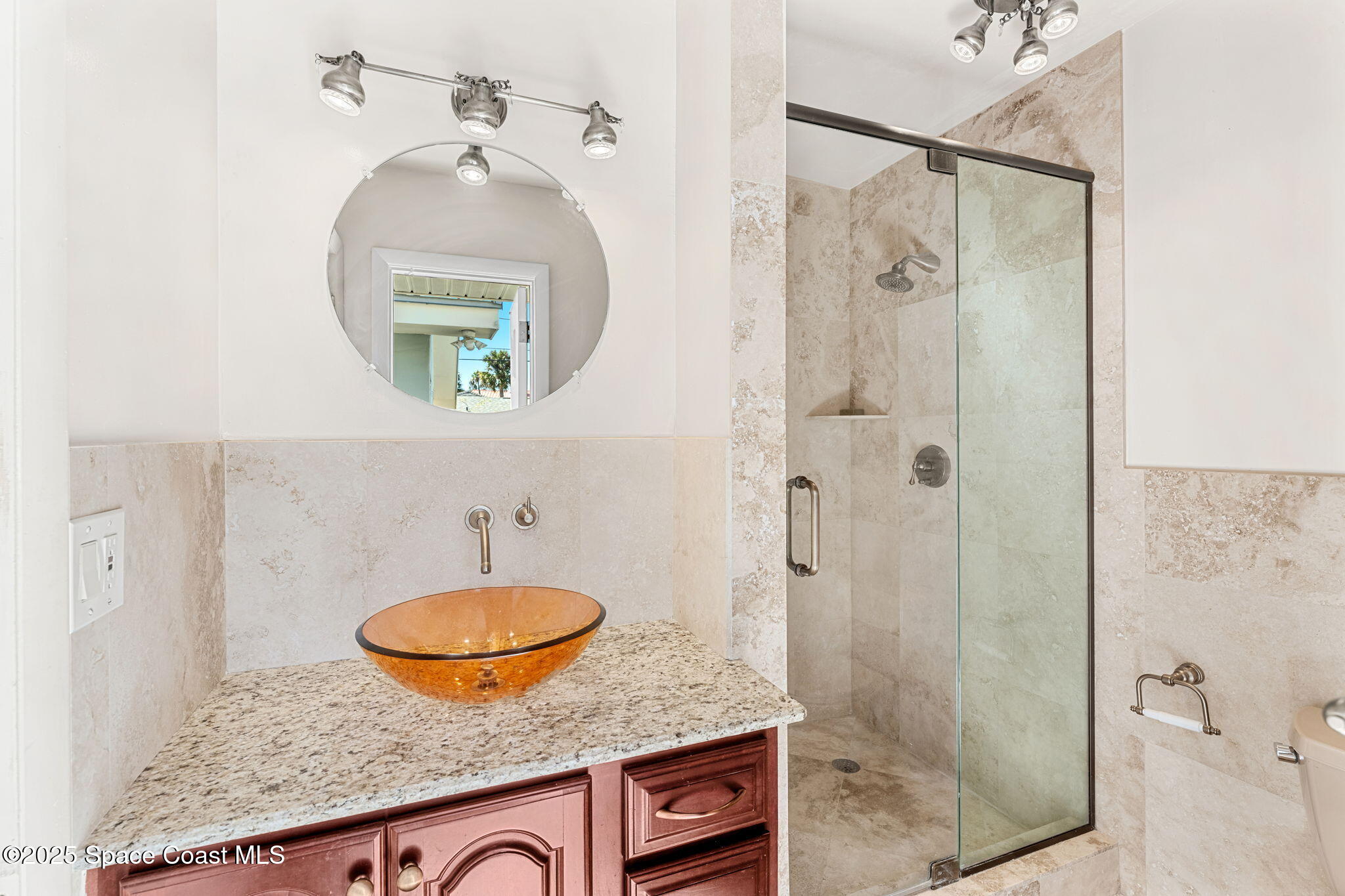 157 Cocoa Avenue Indialantic, FL 32903 - Photo 16 of 36 a bathroom with a granite countertop sink mirror and shower