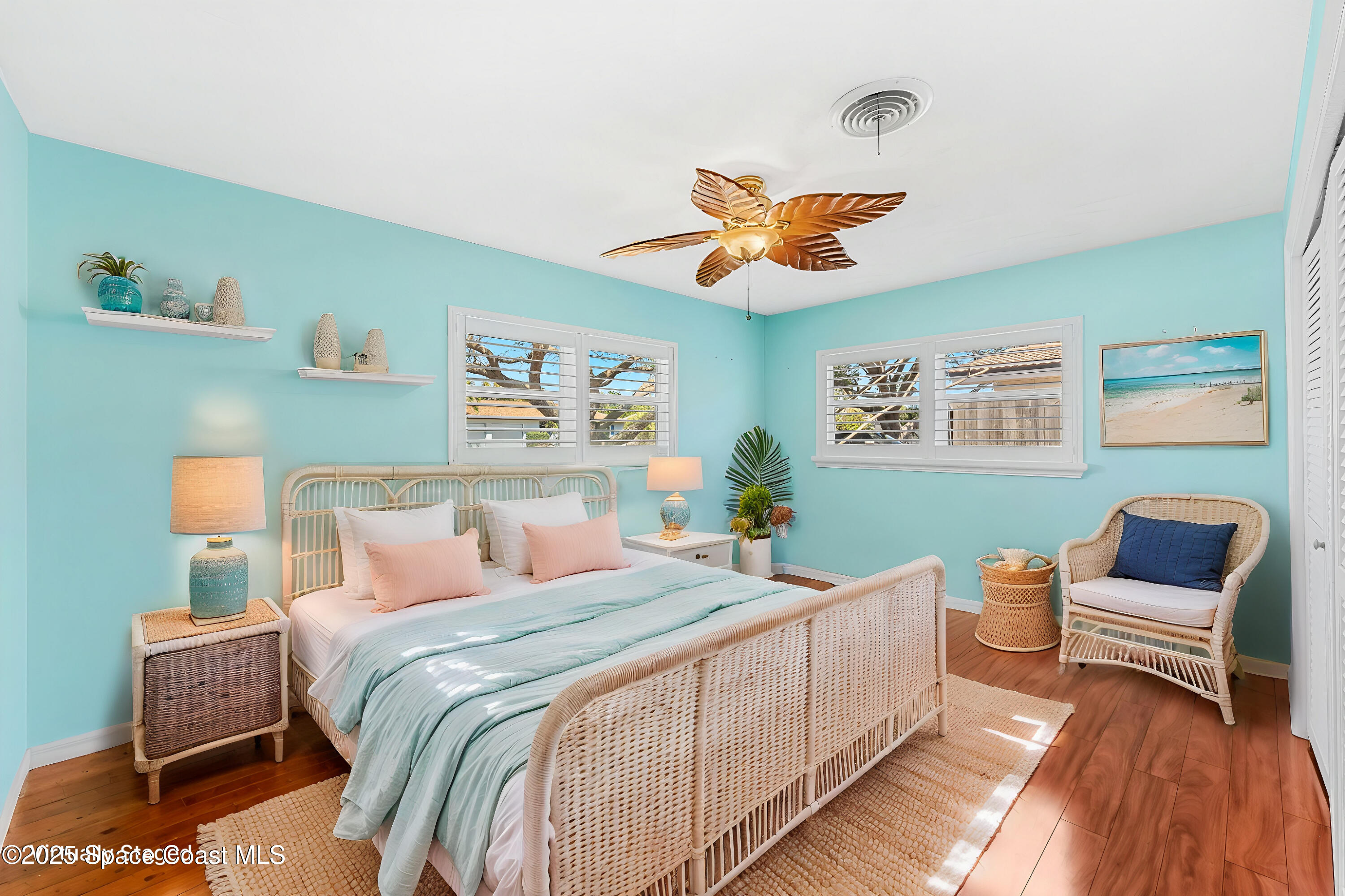 157 Cocoa Avenue Indialantic, FL 32903 - Photo 17 of 36 a bedroom with a bed and a chandelier