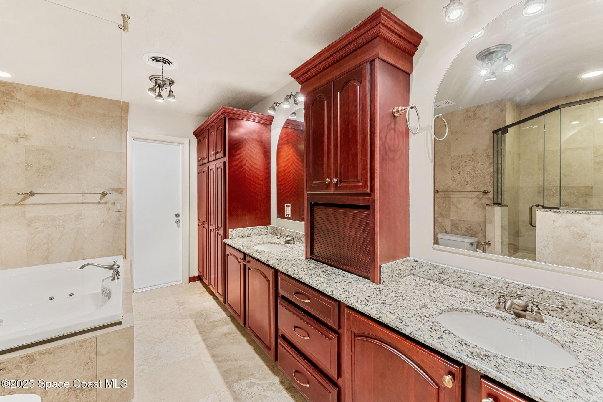 157 Cocoa Avenue Indialantic, FL 32903 - Photo 20 of 36 a spacious bathroom with a granite countertop double vanity sink a mirror and a shower