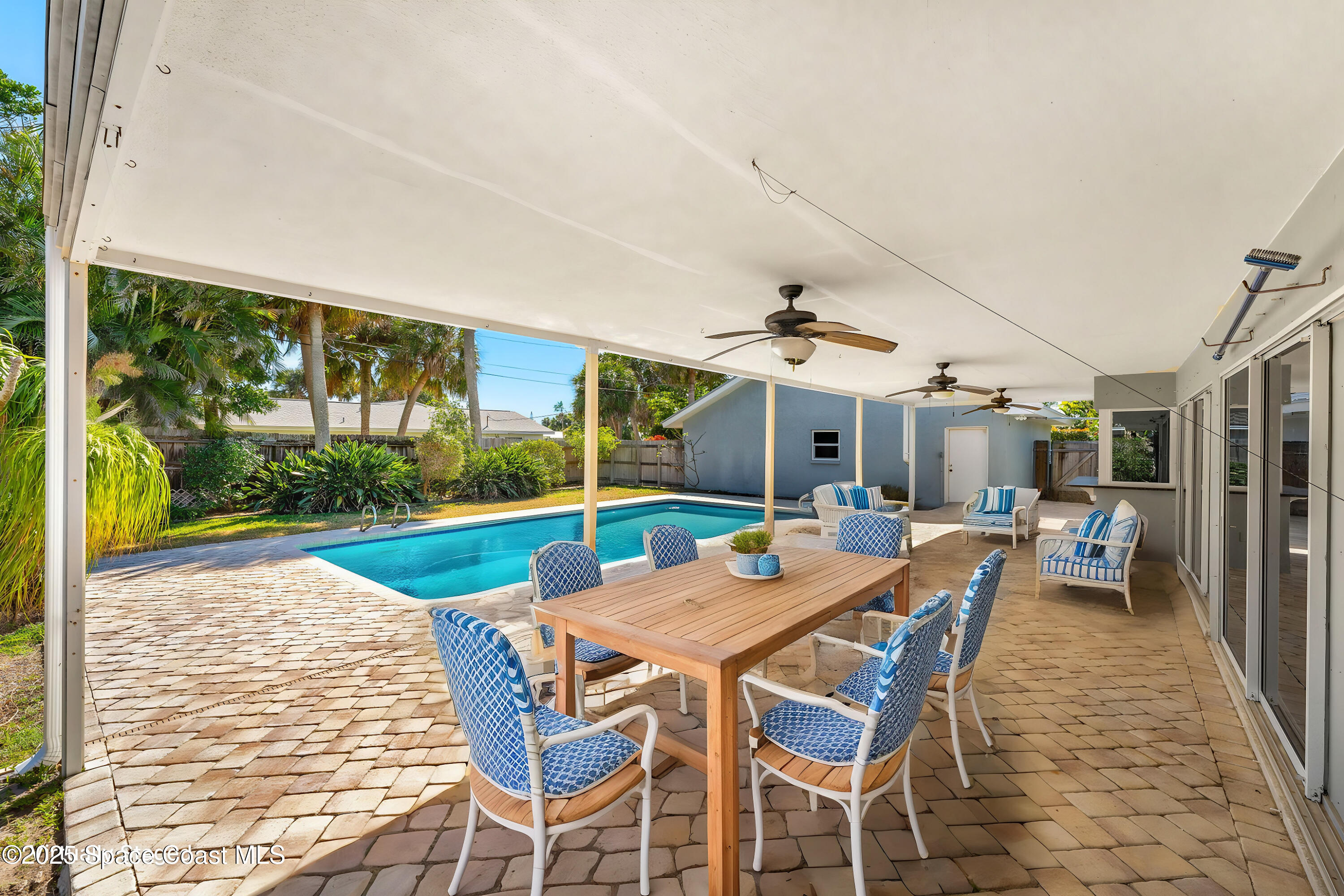 157 Cocoa Avenue Indialantic, FL 32903 - Photo 21 of 36 a view of a patio with a dining table and chairs
