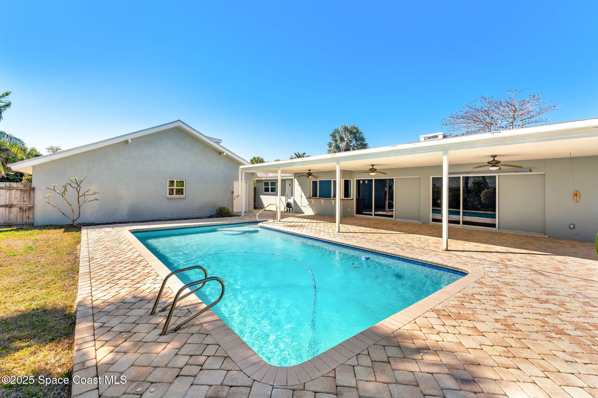 157 Cocoa Avenue Indialantic, FL 32903 - Photo 23 of 36 a front view of a house with a yard