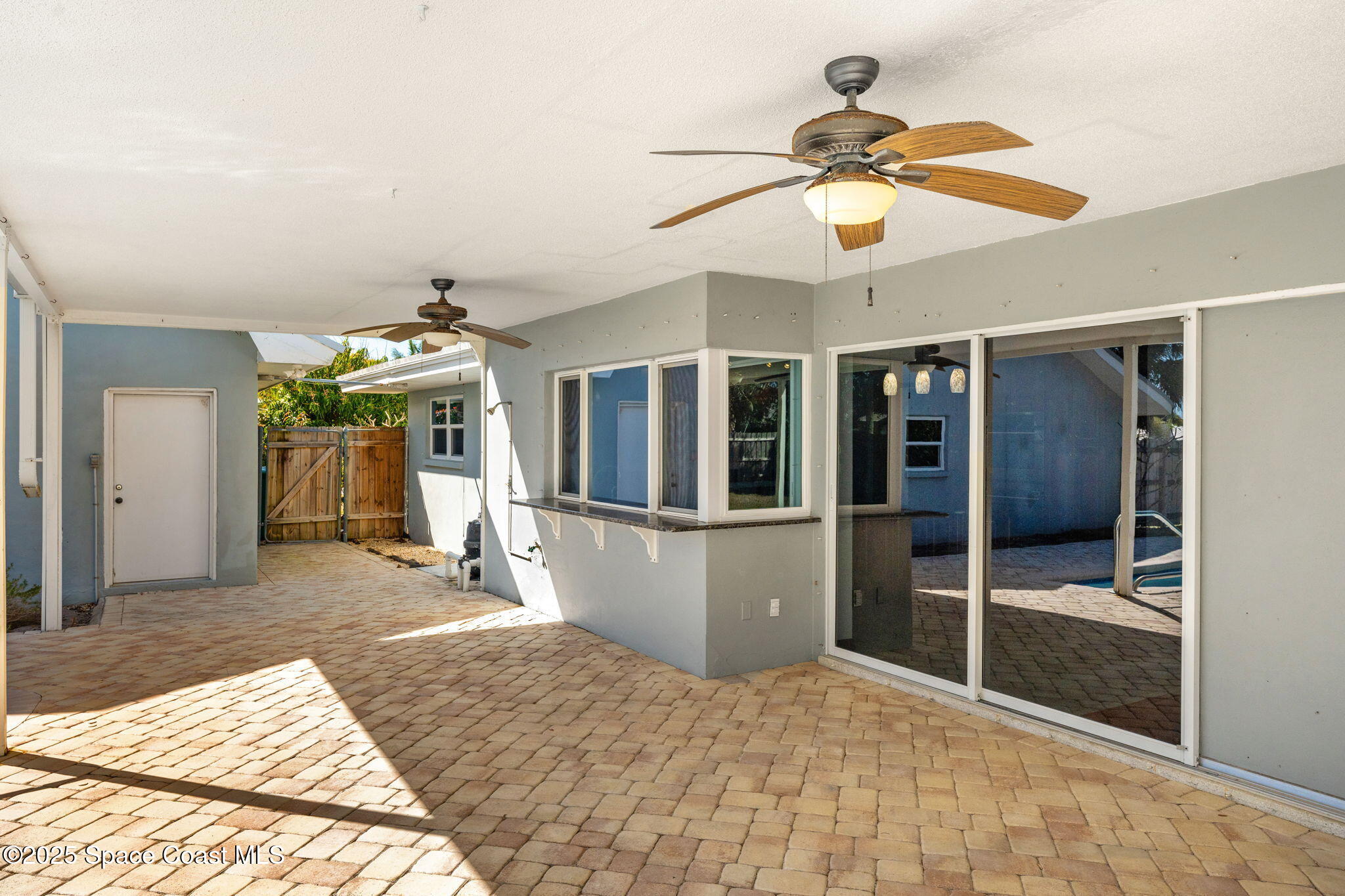 157 Cocoa Avenue Indialantic, FL 32903 - Photo 25 of 36 a bedroom with a bed and a chandelier