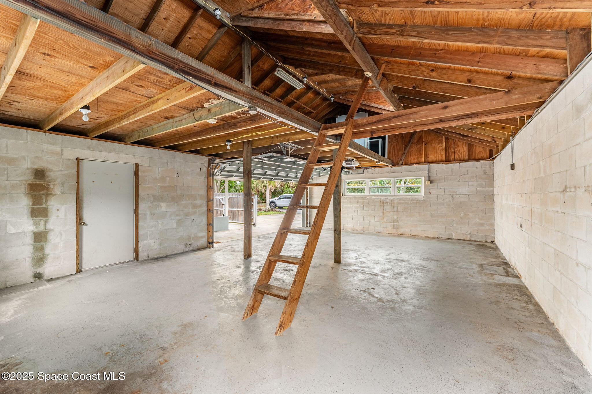 157 Cocoa Avenue Indialantic, FL 32903 - Photo 27 of 36 a view of a room with wooden floor